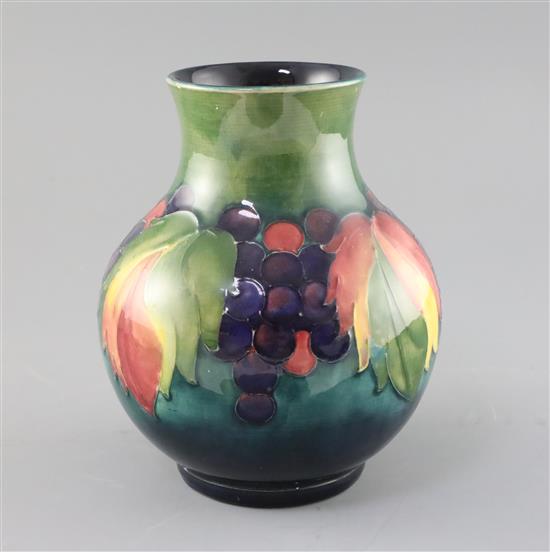 A Moorcroft leaf and berry baluster vase, 1950s, H.19.5cm